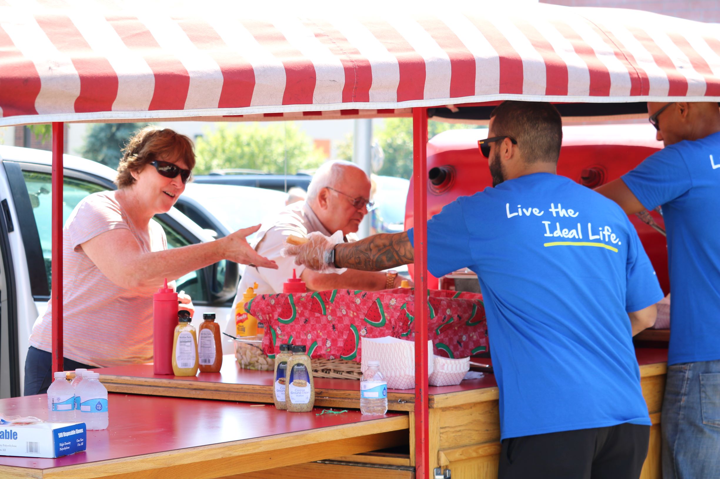 Woman and man getting hamburger at Community Event