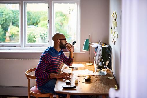 Man sitting at desk working from home