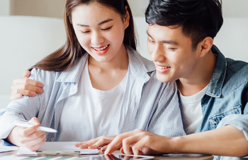 Young couple looking at paper