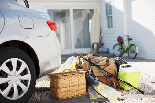 Summer vacation items sitting by car