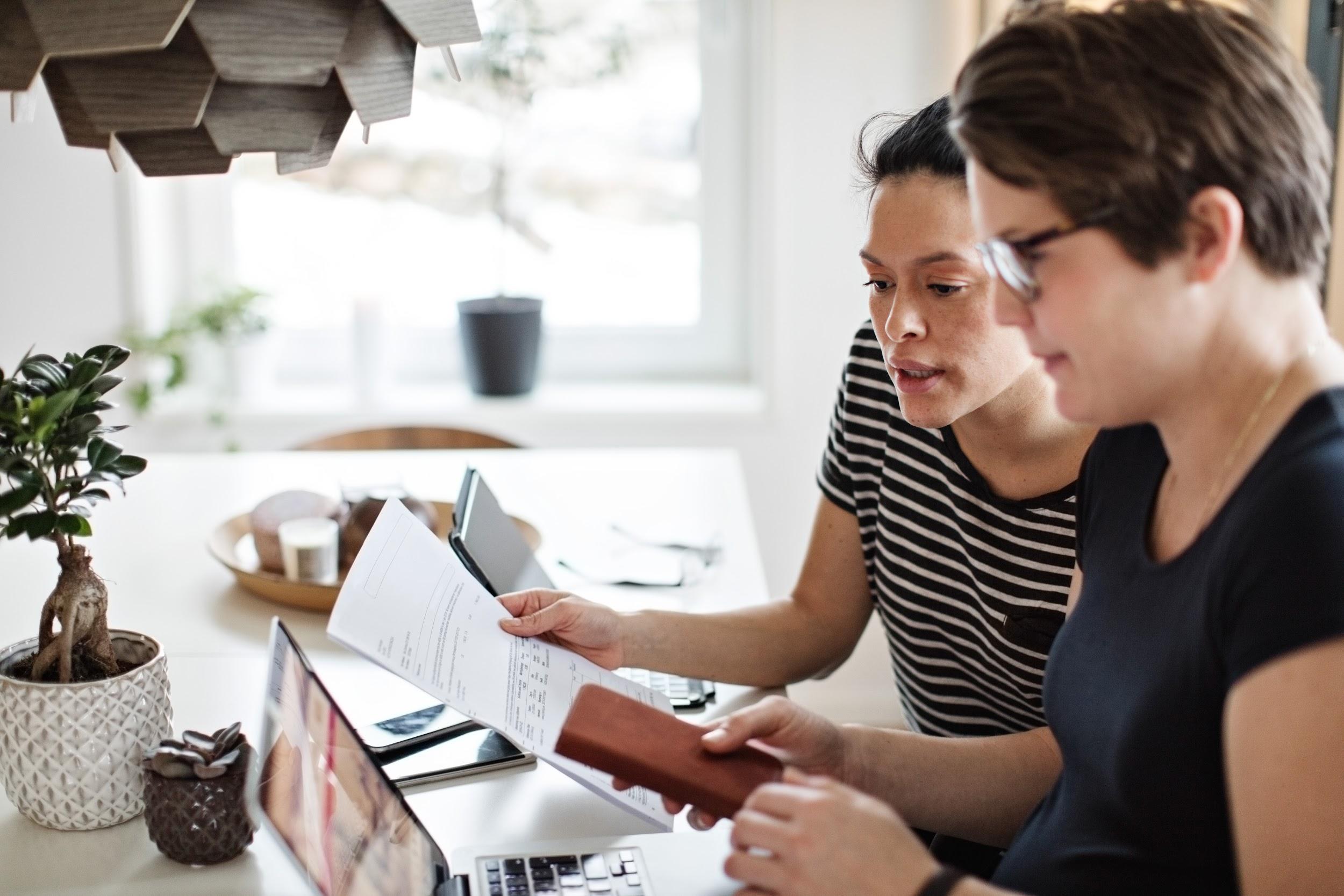 Two women looking at laptop computer