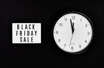 black Friday sign with analog clock