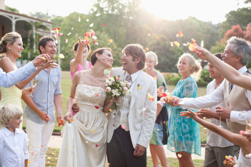 people celebrating bride and groom at wedding