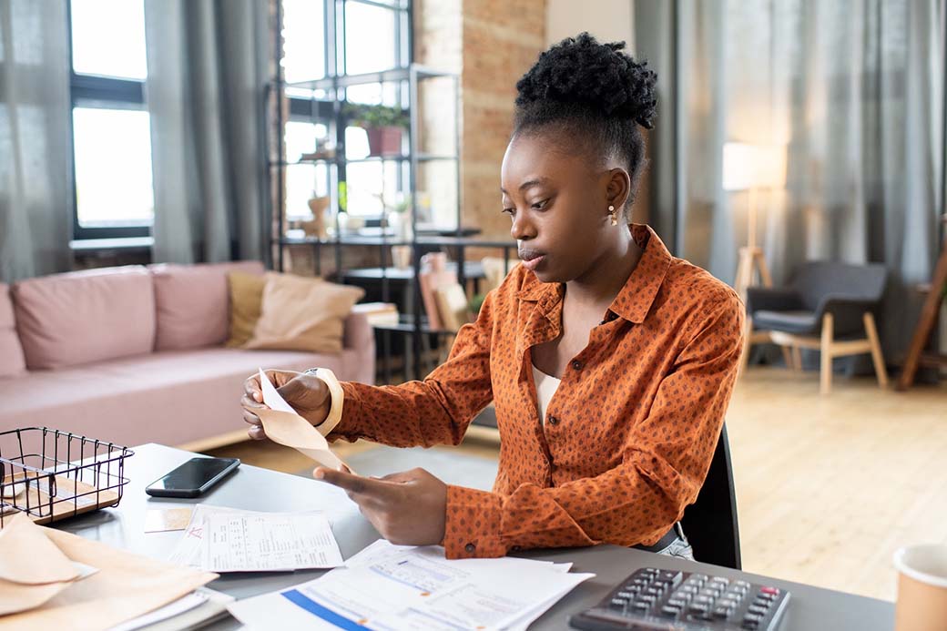 Woman deciding whether to invest or pay off debt