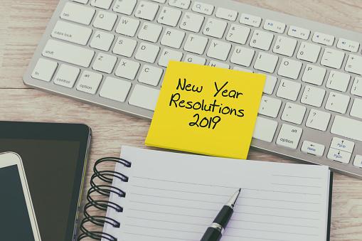 2019 New Year's Resolutions written on post-it note