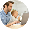 father and baby on computer