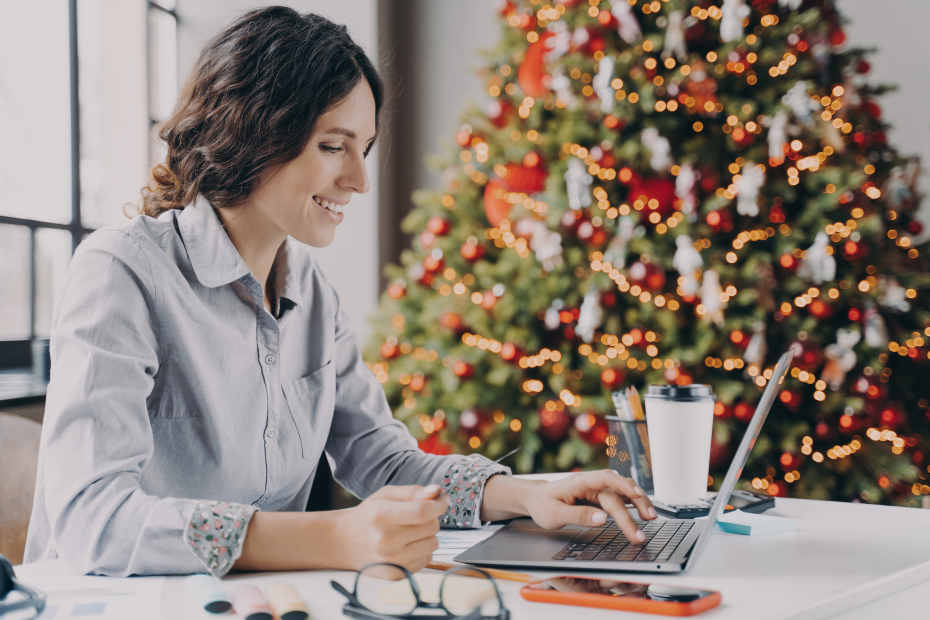 young-woman-using-laptop-for-christmas-shopping-securely.png